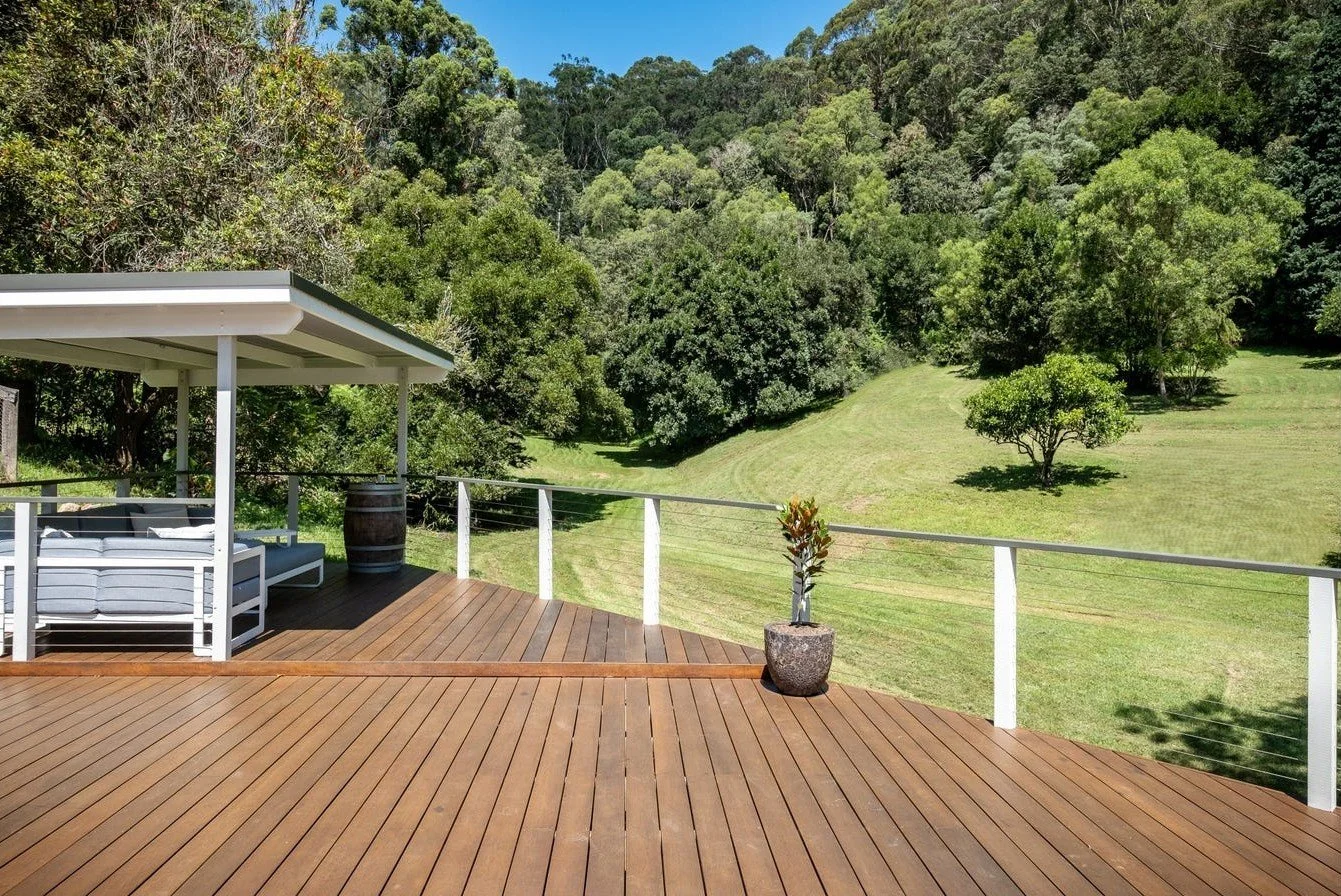 Acreage landscape design Matcham Central Coast with natural outdoor living, wooden deck and outdoor furniture. 