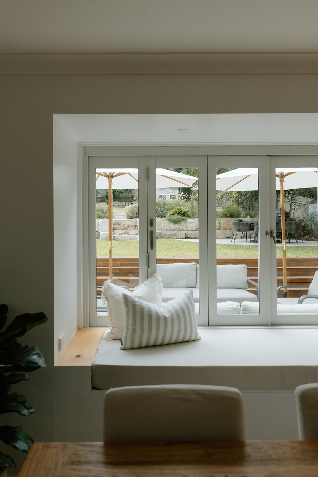 Interior design detail of a daybed with natural materials and soft tones by Everyday Designs Central Coast