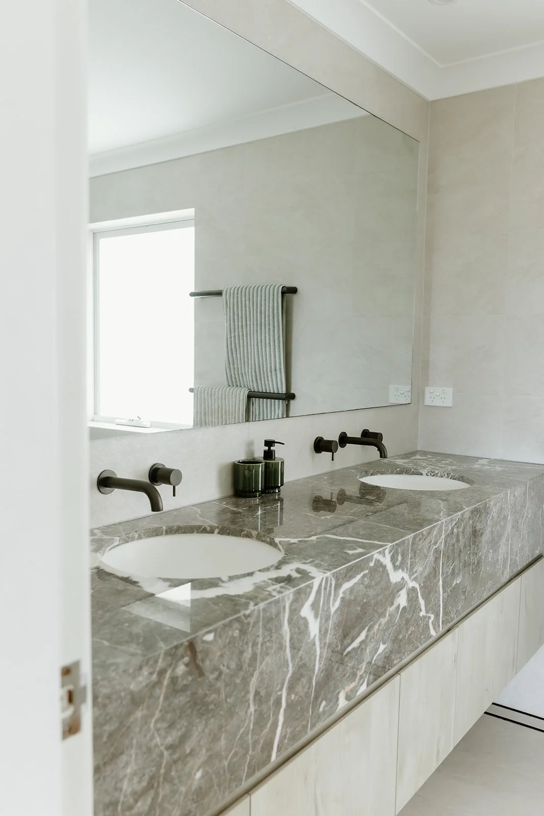 Bathroom renovation Central Coast with warm tones and natural finishes by Everyday Designs. 