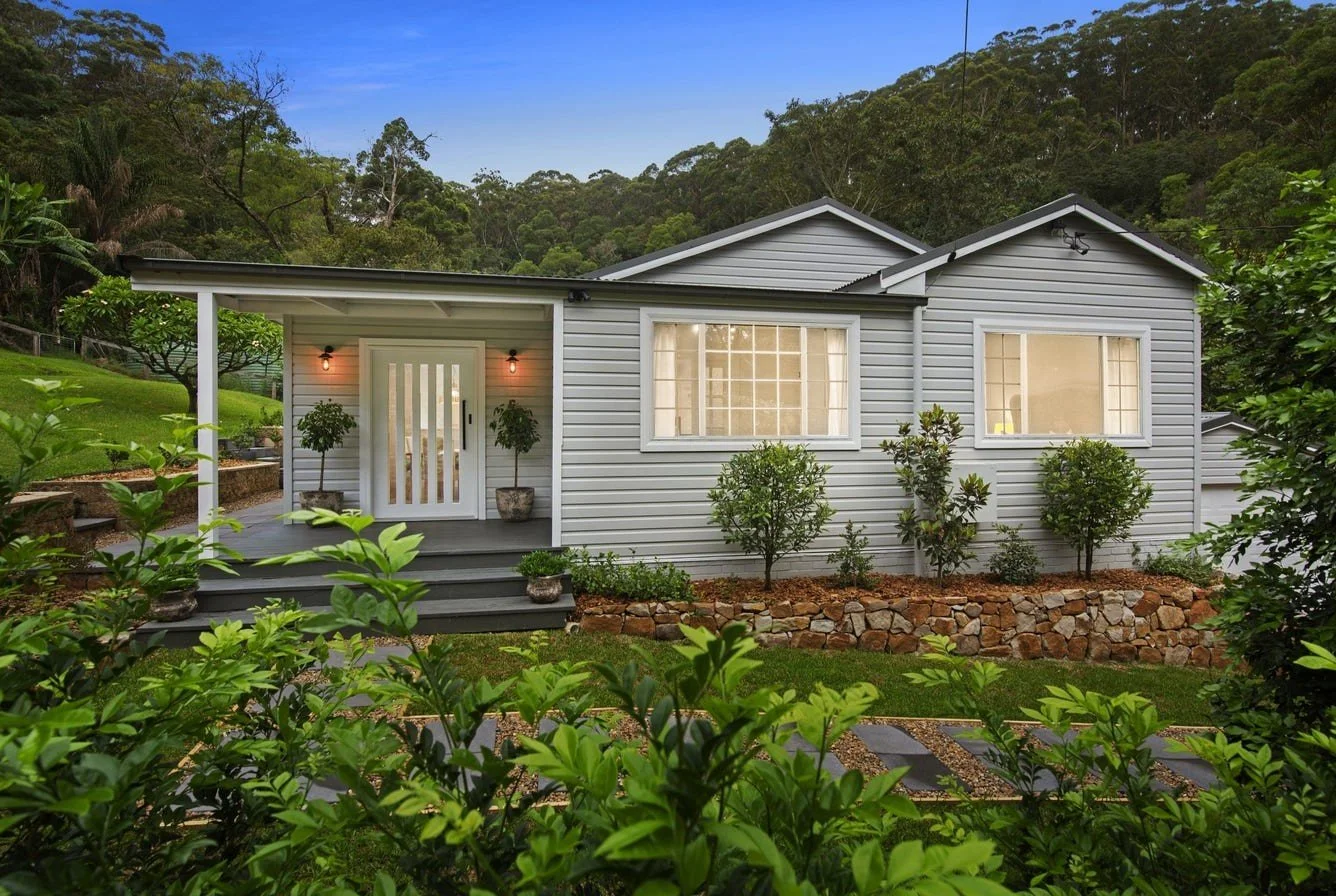 Hamptons, weatherboard landscape design in a Matcham Central Coast acreage, with natural outdoor living and greenery. 