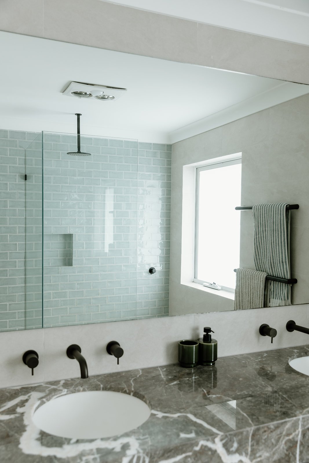 Bathroom renovation Central Coast with warm tones and natural finishes by Everyday Designs.