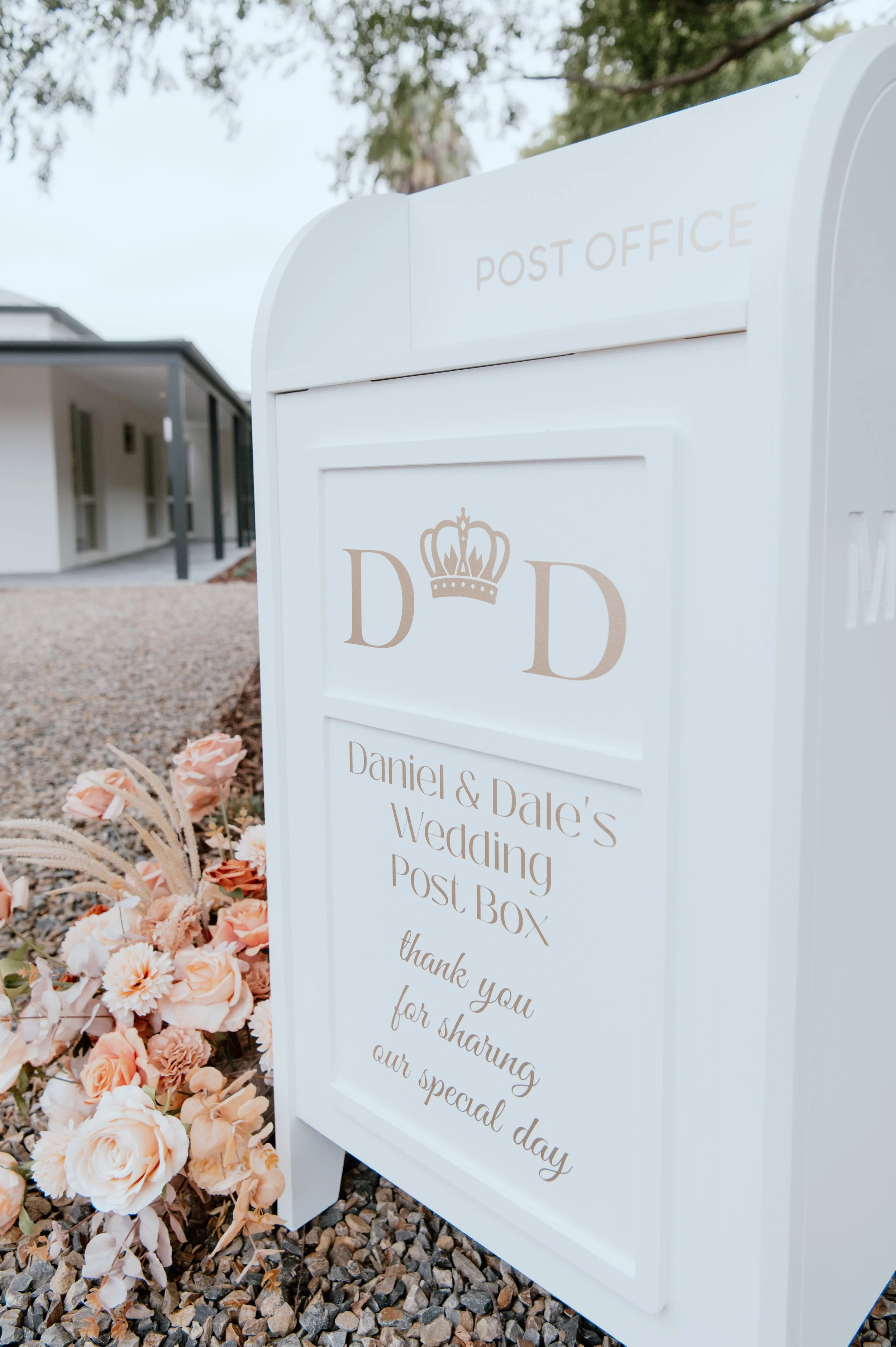 White collapsible wedding wishing well mailbox styled like a post box—used for collecting cards and messages at weddings and events. Customisable panel, flat-pack design, available for hire in Melbourne.