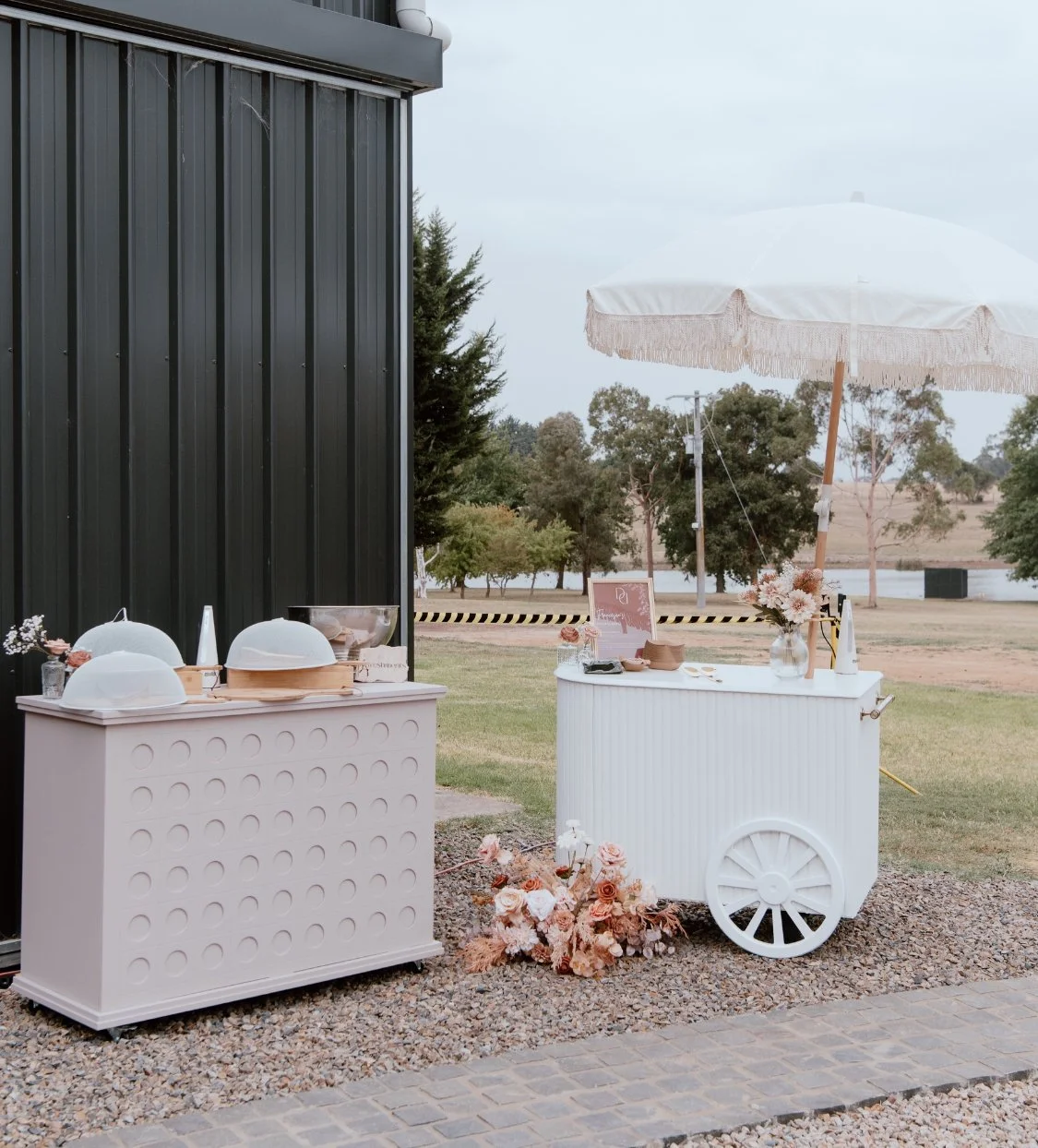 Pale pink collapsible event cart with spotted detailing, flat-pack design, and curved canopy—perfect for weddings, dessert tables, and product displays. Tool-free assembly, available for hire in Melbourne.