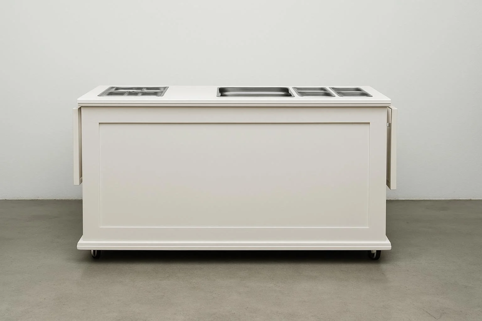 Empty mobile cafeteria or food service cart with stainless steel compartments on a white wall background.