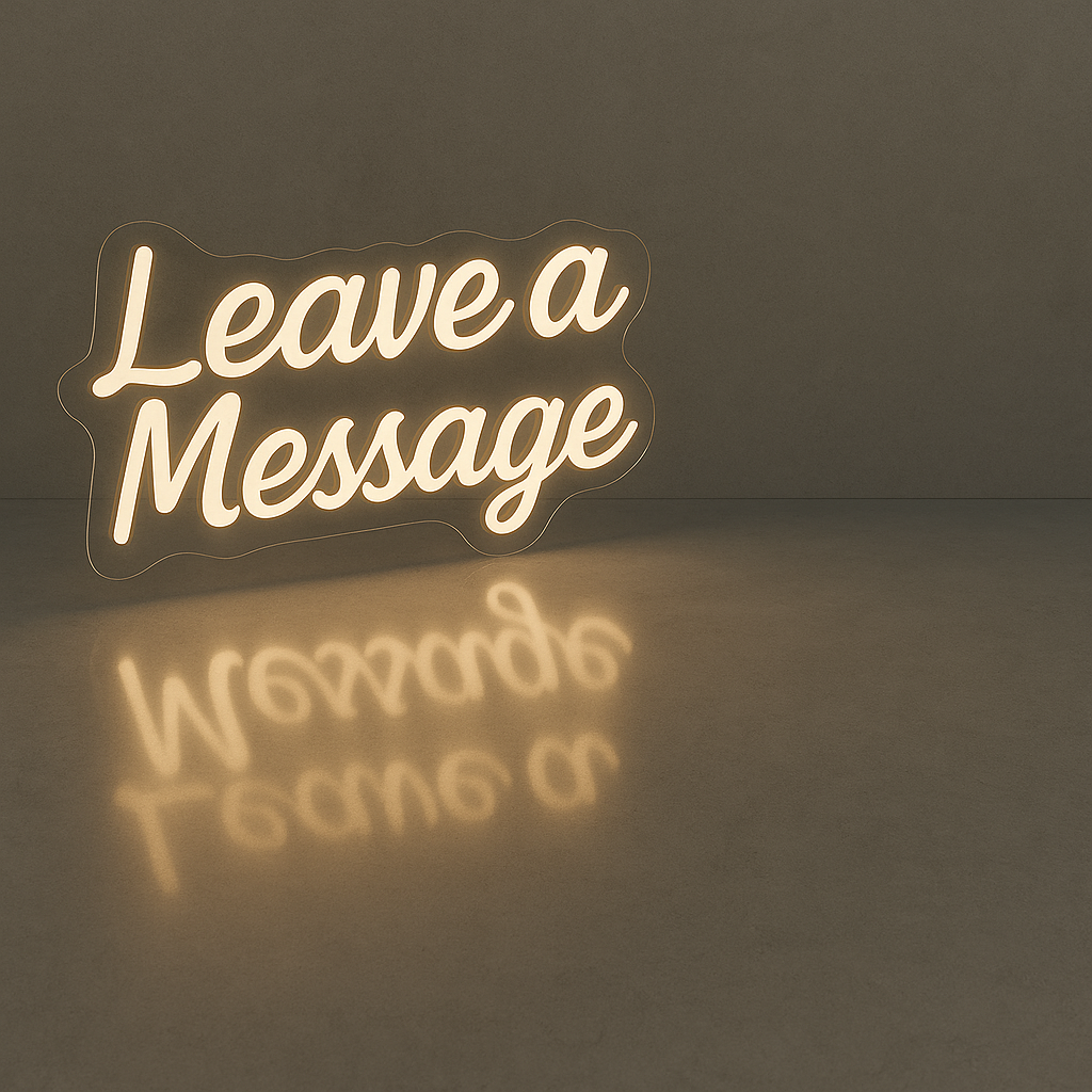 Neon sign that reads "Leave a Message" with its reflection on a smooth surface.