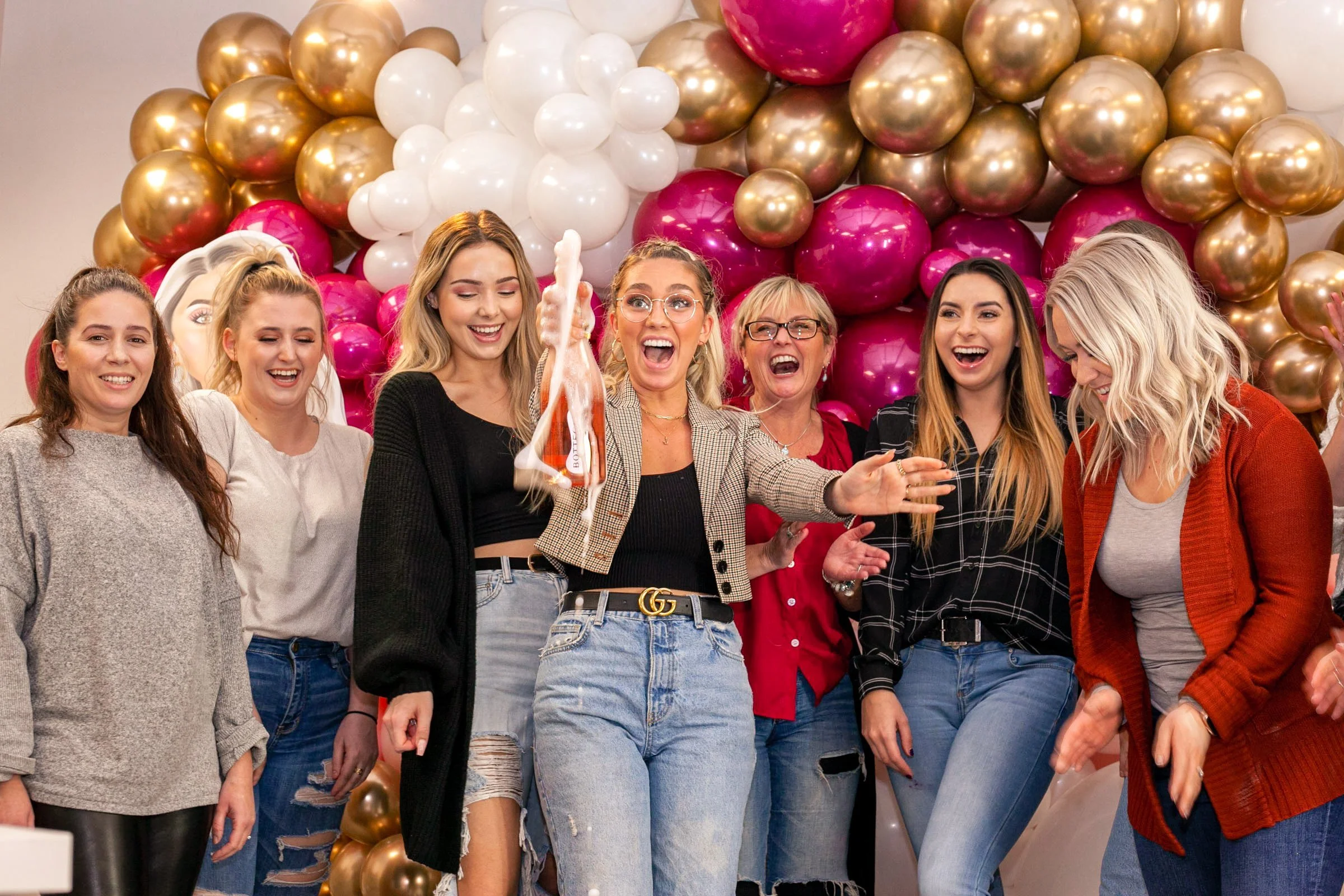 Group of women celebrating at a bridal shower or birthday party with balloon backdrop - event content creator Never Tell Moments LA