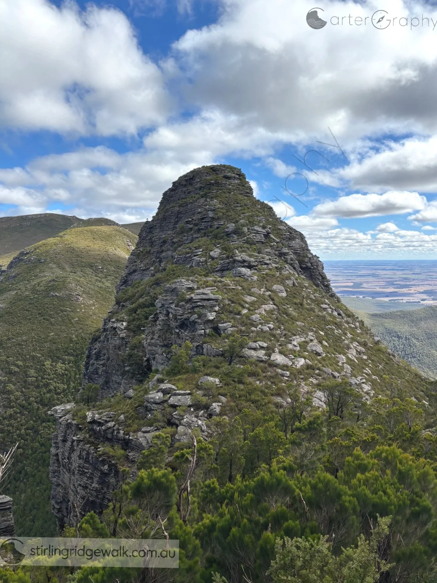 Looking west towards 1st Arrow while descending the north west flank of 2nd Arrow, with Isongerup Peak rising in the background.