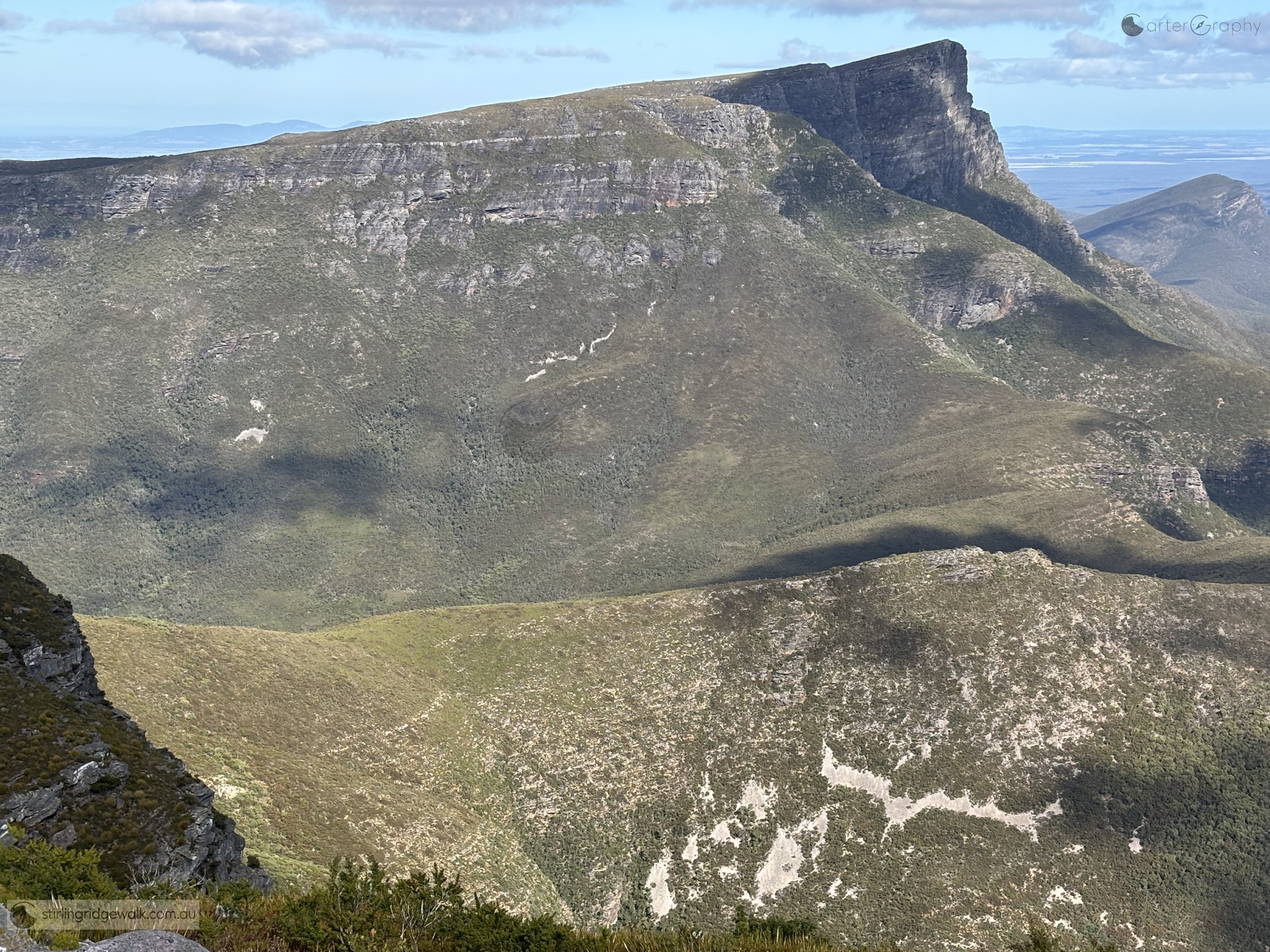 On descent from Isongerup South Peak. In the foreground is the ridgeline running south east to north west. East Peak and Bluff Knoll in the background.
