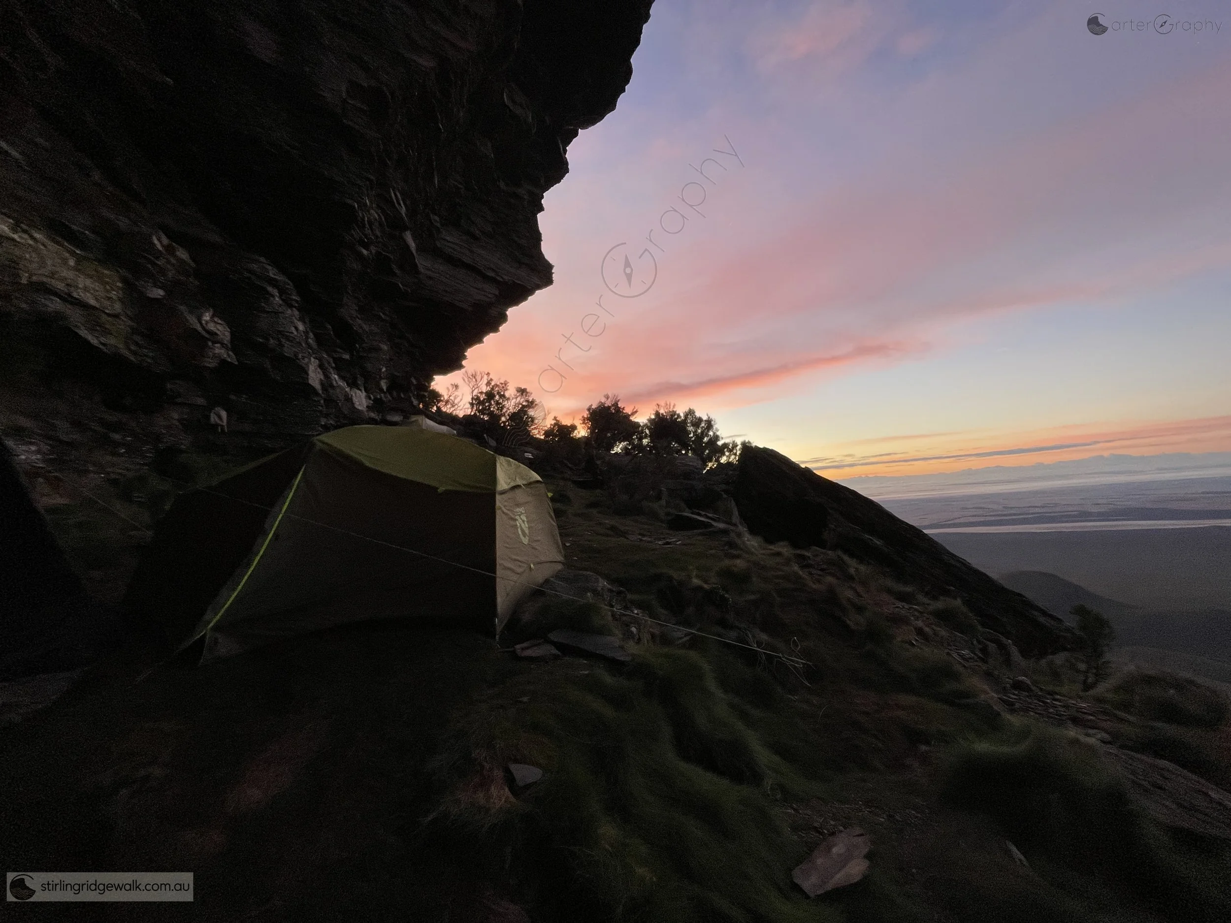 Camping beneath the immense rock overhang of Pyungoorup Cave, with the evening sky illuminating the plains beyond. A beautiful place to spend the night, with remarkable views across the surrounding landscape as the morning light arrives.