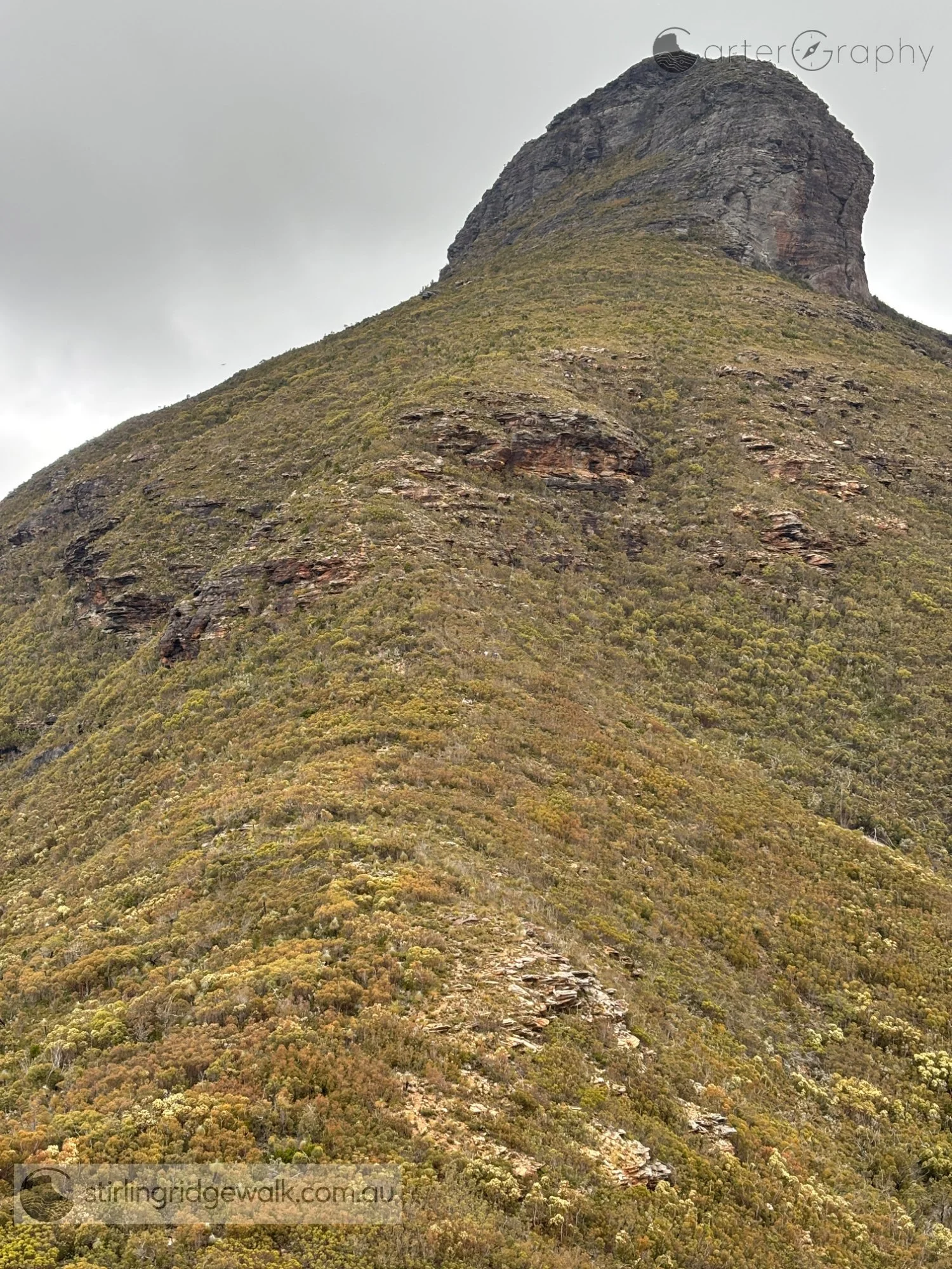Ellen Peak shortly after leaving the campsite north east of Ellen Peak, with the North East Ridge rising steeply towards the imposing rock face at the base of the peak.