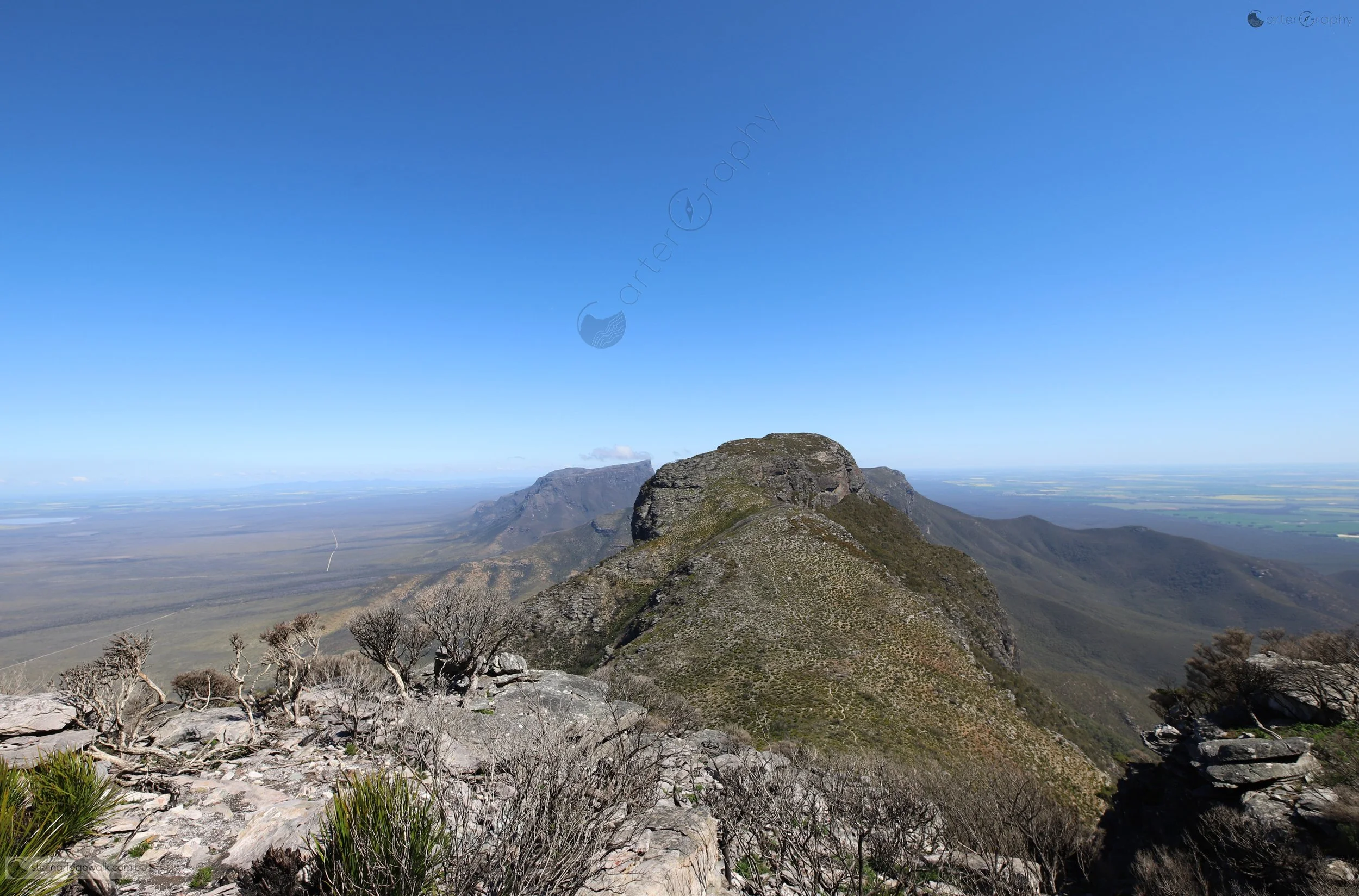Looking west from the summit of Ellen Peak, with the track clearly visible following the ridge towards Pyungoorup Peak. Bluff Knoll can be seen to the left of Pyungoorup Peak, while Isongerup North Peak is visible to the right.