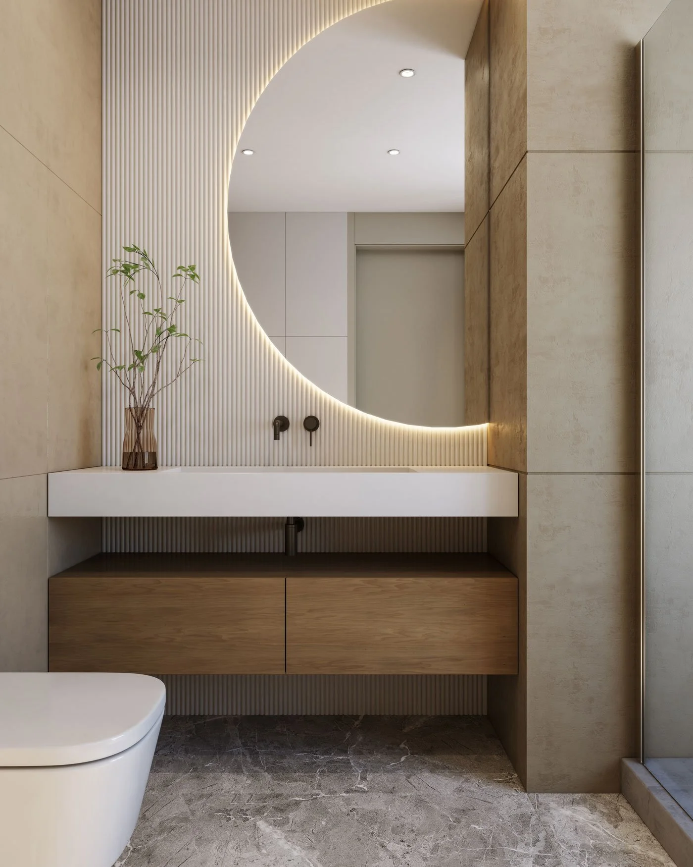 Modern bathroom vanity with large backlit round mirror, a wooden cabinet, a white countertop with integrated sink, a potted plant, and minimalist black fixtures.