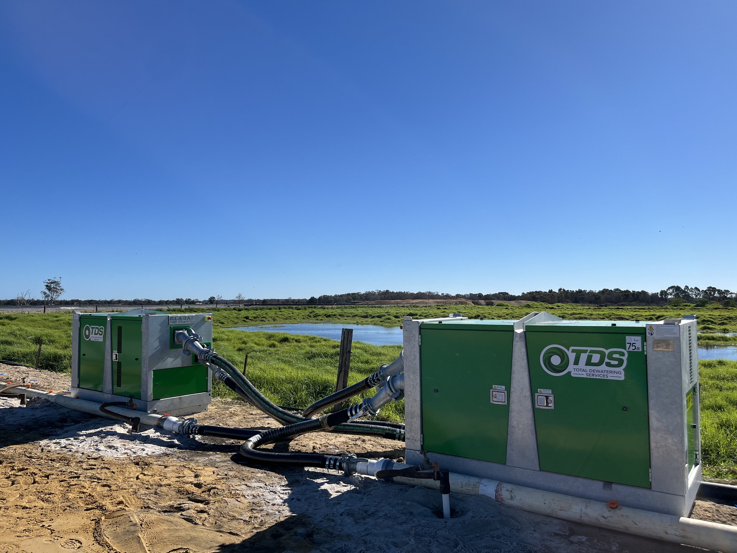 Two TDS wellpoint dewatering pumps connected to header pipework on a Western Australian project site