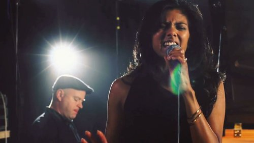 Parry singing on stage.png