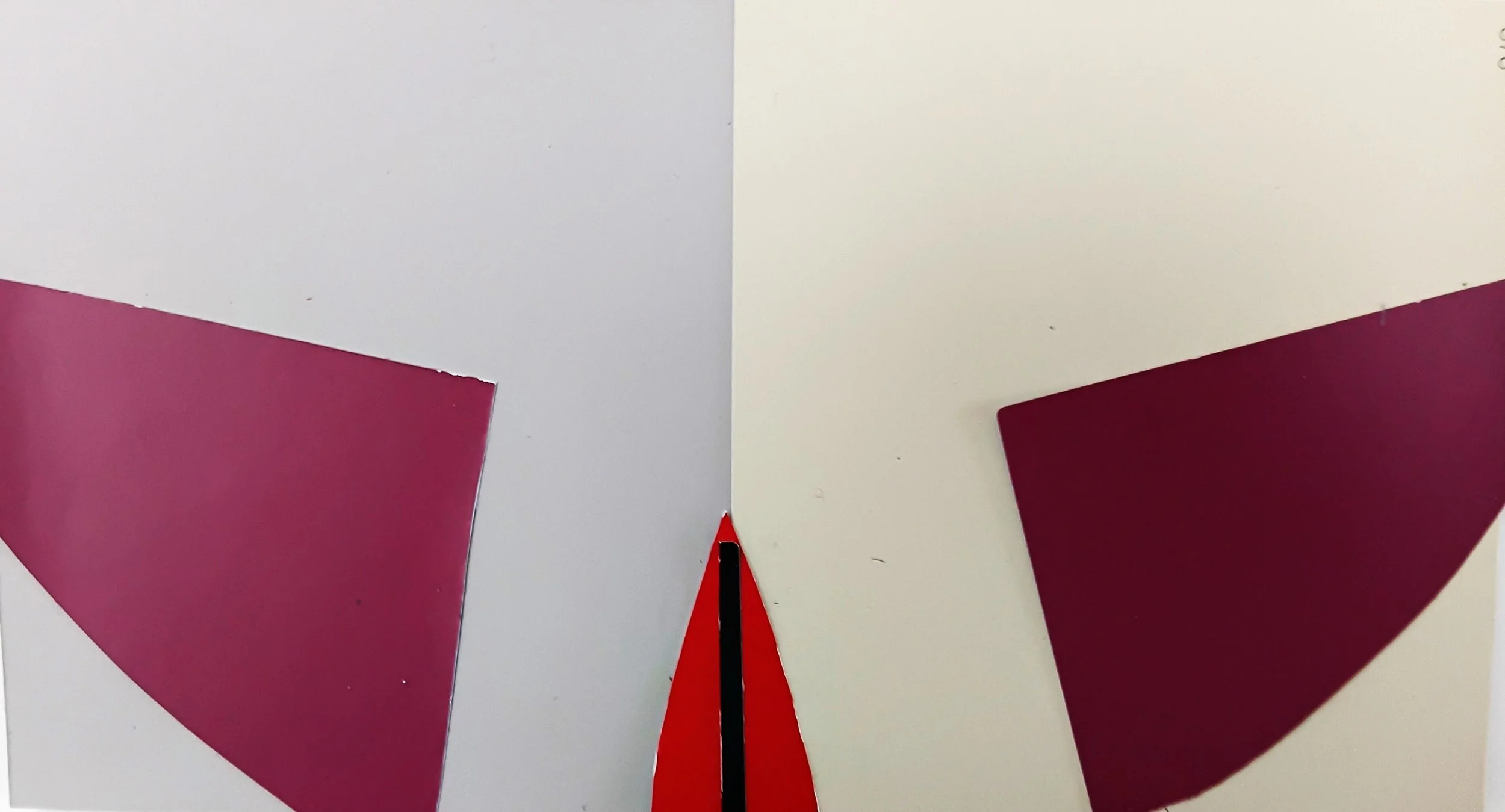 Close-up of a balance scale with two red, purple, and white sections, separated by a black and red pointer, on a white background.