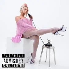 A woman with pink hair sitting with one leg raised on a chair, wearing a pink off-the-shoulder top and high heels, with a rotary phone on a small table in front of her, and a Parental Advisory warning label at the bottom.