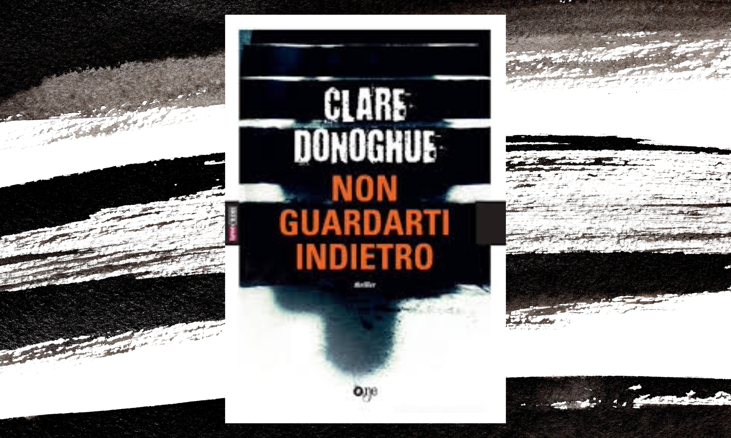 Book cover with black, white, and orange text, featuring an abstract dark figure in the background. The title reads 'Clare Donoghue Non Guardarti Indietro'.