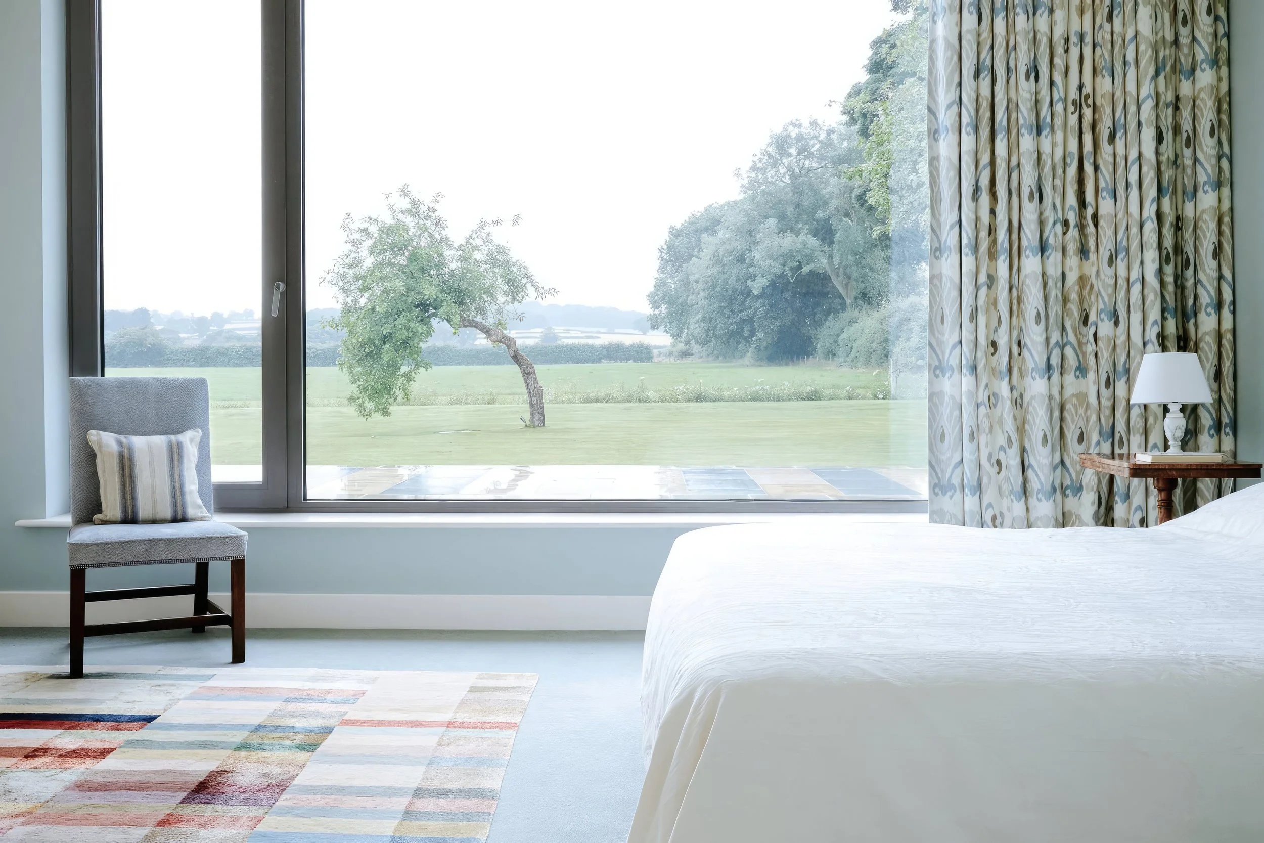 Cunelands, North Yorkshire — master bedroom interior with views to the landscape