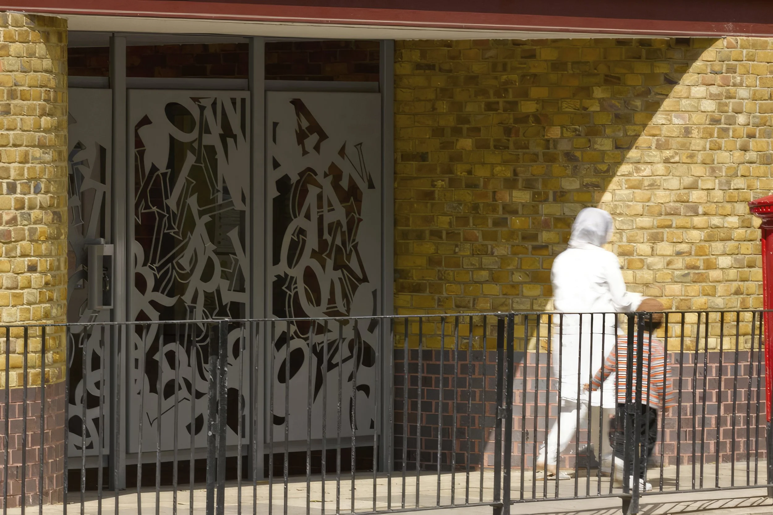 Torriano School, London — new memorial gate with figurative cut-out detail