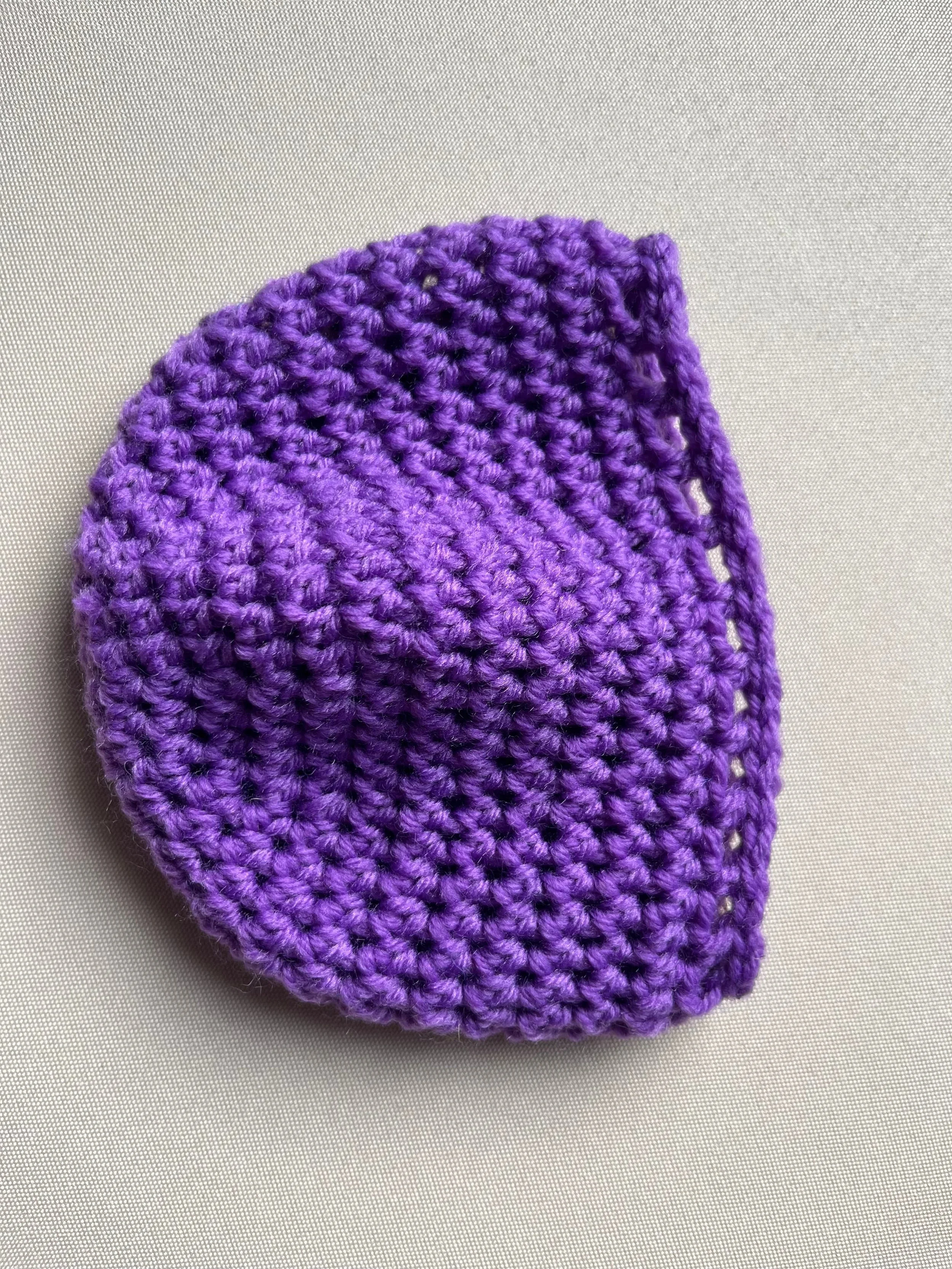 Handmade baby beanie in purple soft acrylic blend yarn by Tidestitch angle 2..jpg.jpg