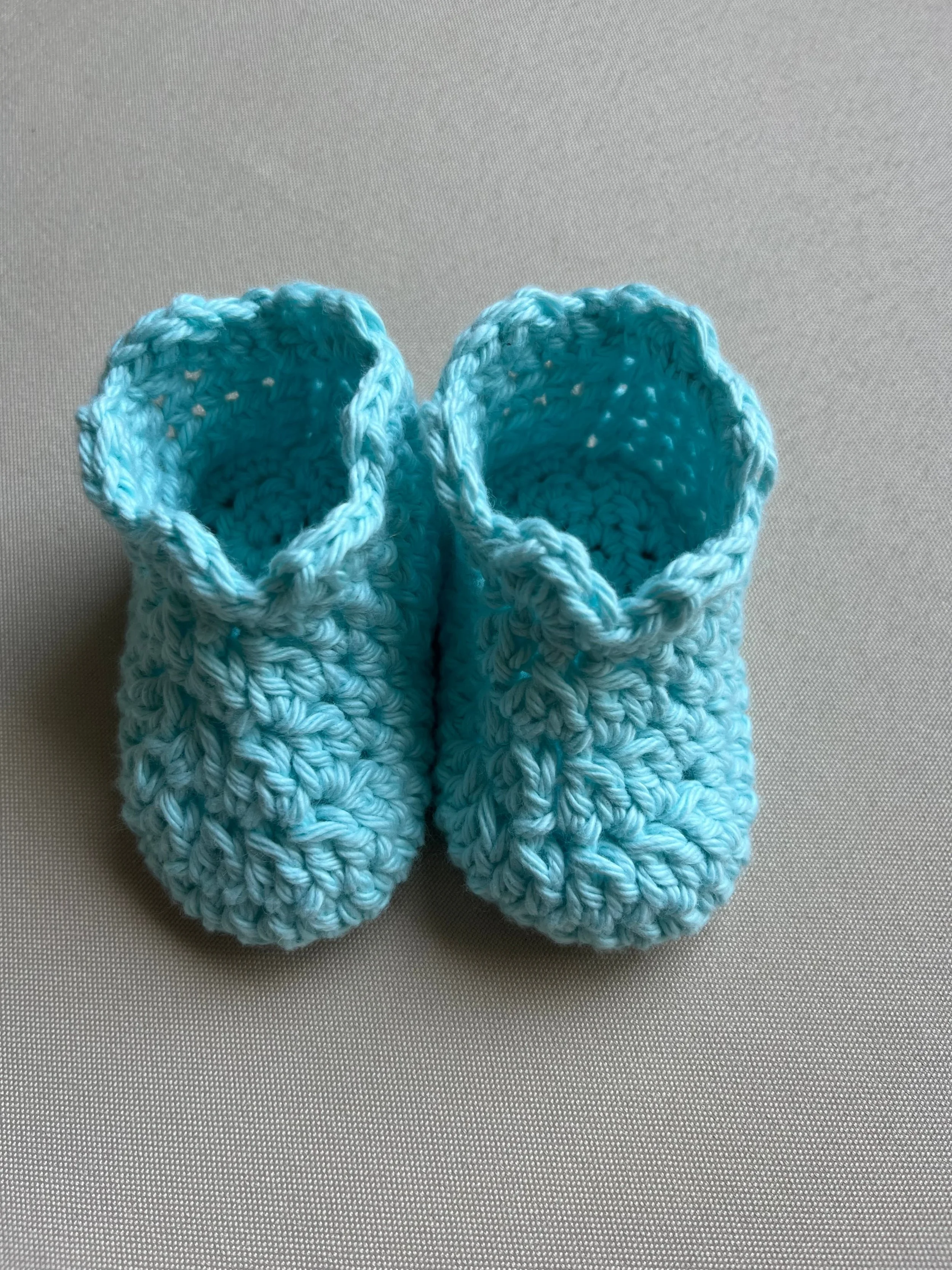 Handmade baby booties in aqua soft cotton yarn by Tidestitch.jpg