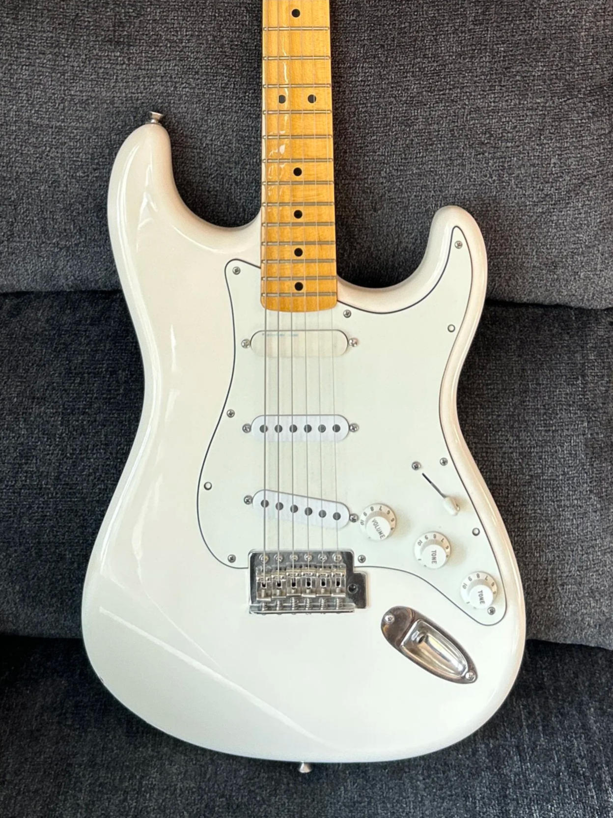 Olympic white electric Stratocaster with solid maple neck.