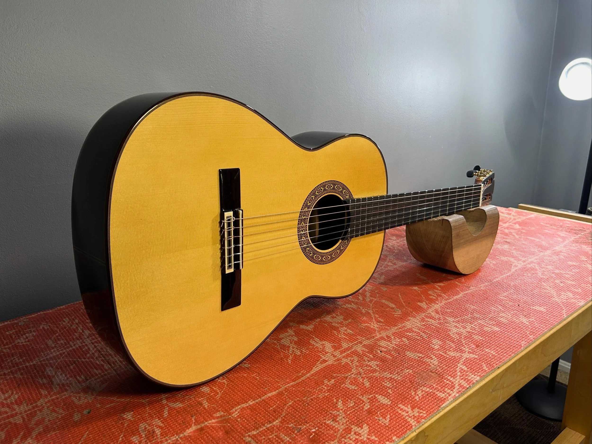 A Pavan TP-30. Very responsive and lightly built spruce guitar. 640mm scale.