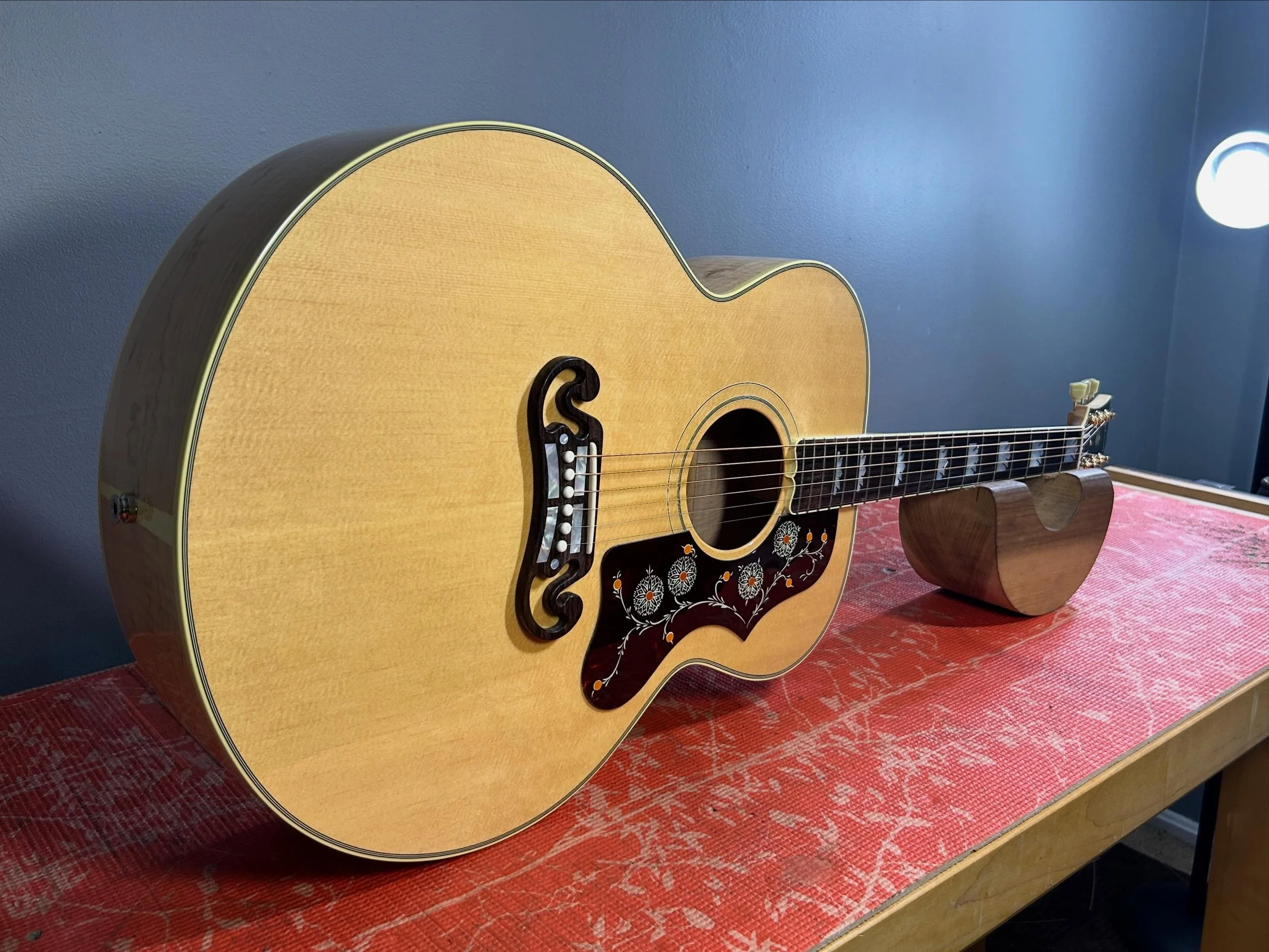 Gibson SJ200. An absolute canon. Removed the factory pickup, installed a new one and set it up.