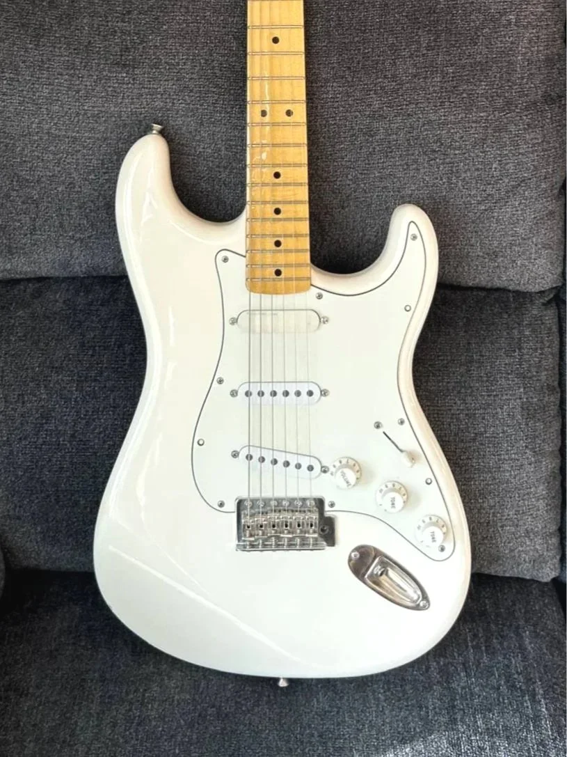 A white Fender Startocaster Guitar