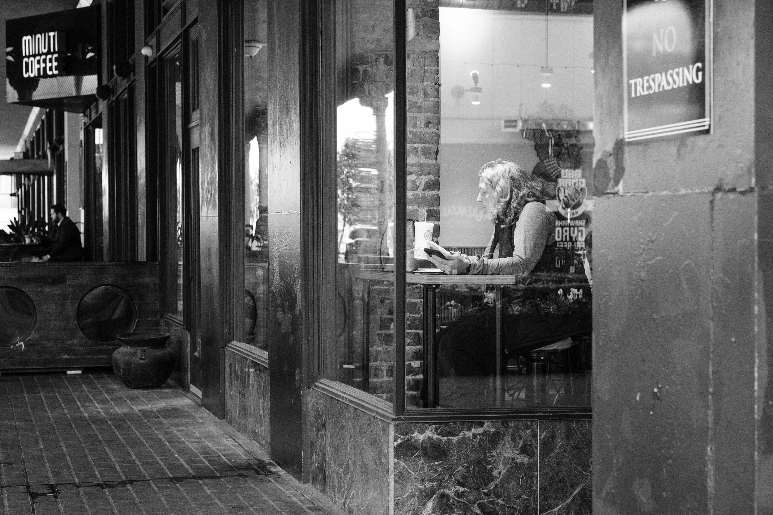 lady reading during her quiet lunch in downtown houston