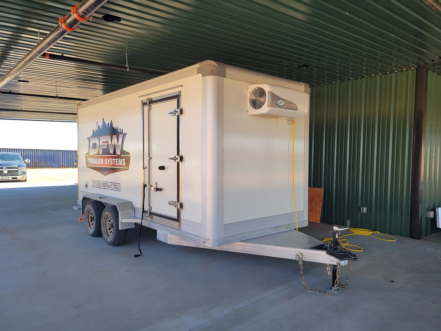 7 by 16 bumper-pull freezer trailer connected to 120-volt power