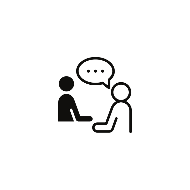 Icon of two people sitting at a table having a conversation, with a speech bubble containing three dots.