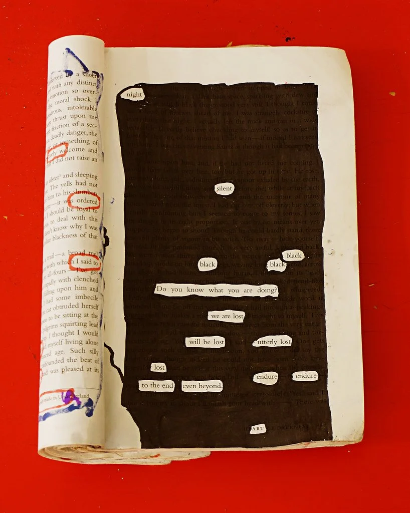 A black painted rectangle on a page of a book with white words cut out and glued inside. The words include 'night', 'silent', 'black', 'Do you know what you are doing?', 'we are lost', 'will be lost', 'utterly lost', 'lost', 'endure', 'to the end', '