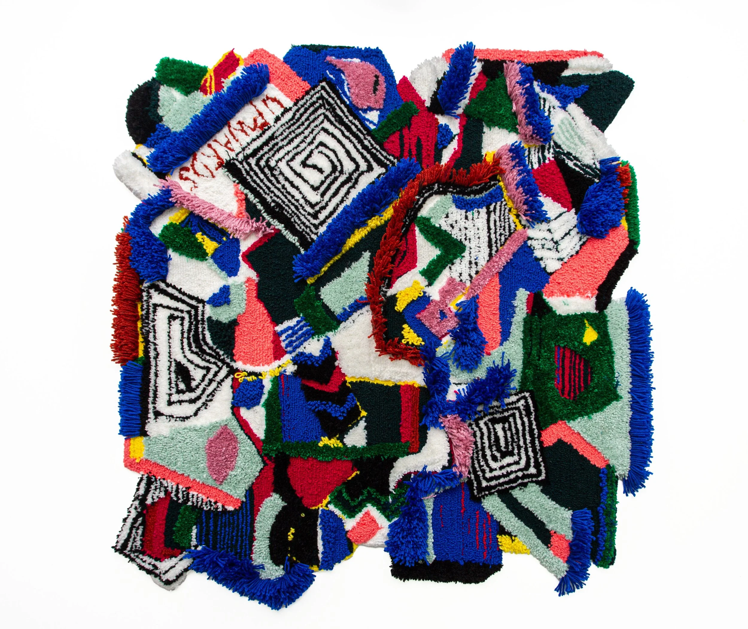 Colorful abstract rug with various geometric shapes and patterns, featuring black, white, red, blue, green, pink, and yellow colors on a white background.