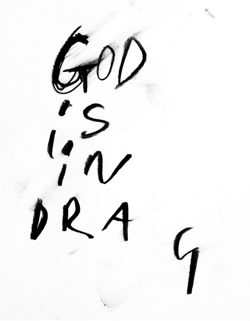 Handwritten text on paper that says 'GOD IS IN MY DNA' in black ink.