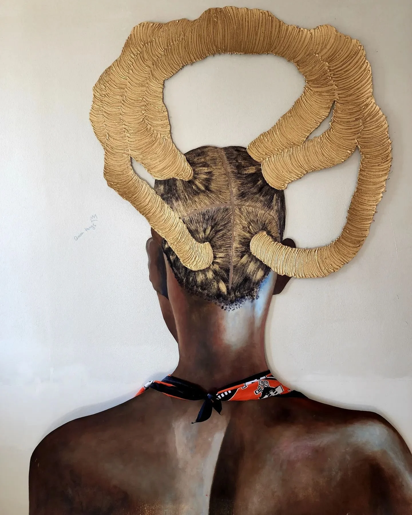 An art piece combining a photo of the back of a person with dark skin and short hair, and a large skull with golden ram horns attached above their head.