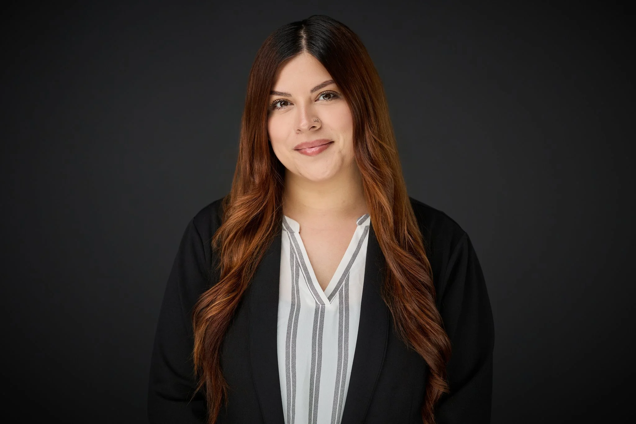 Headshot of administrative assistant, Victoria Andazola.