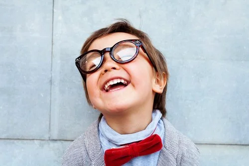 Child with eyeglasses that needs vision coverage.