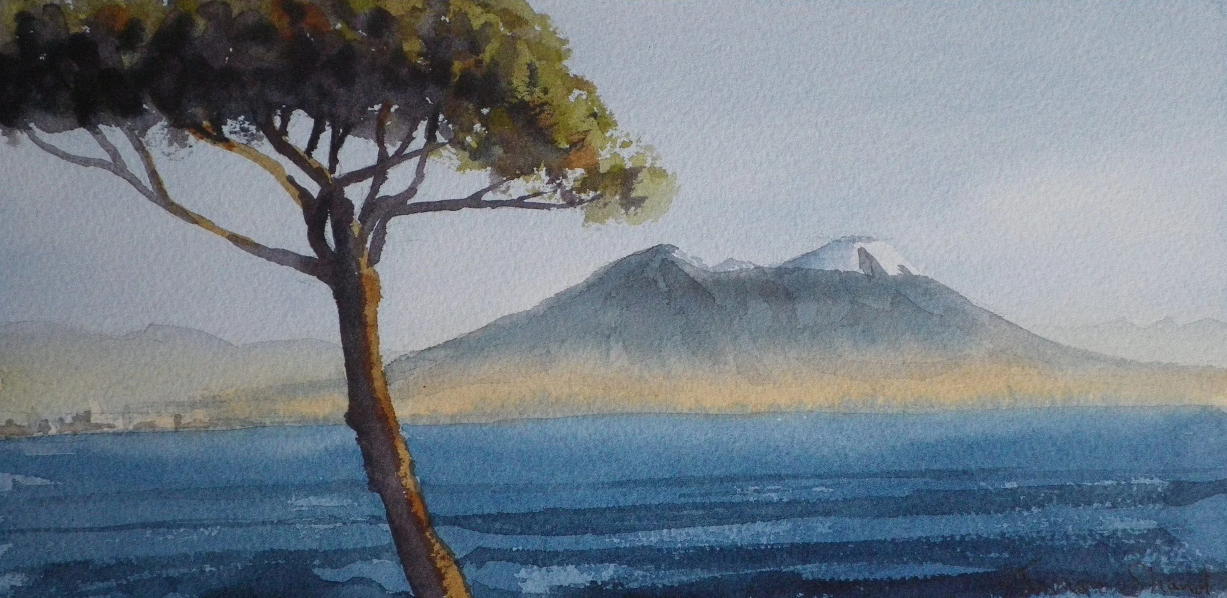 Watercolor painting of a landscape showing a large tree in the foreground, a body of water with horizontal blue strokes, and distant mountains with a hint of snow on one peak under a light sky.