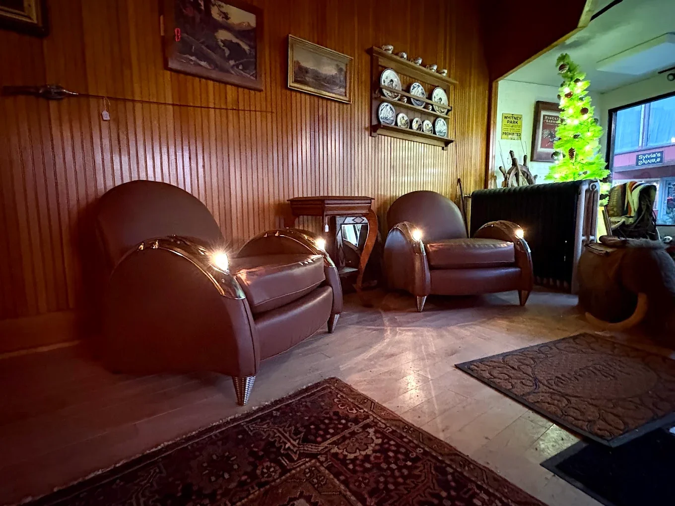 Antique club chairs with lights in the armrests