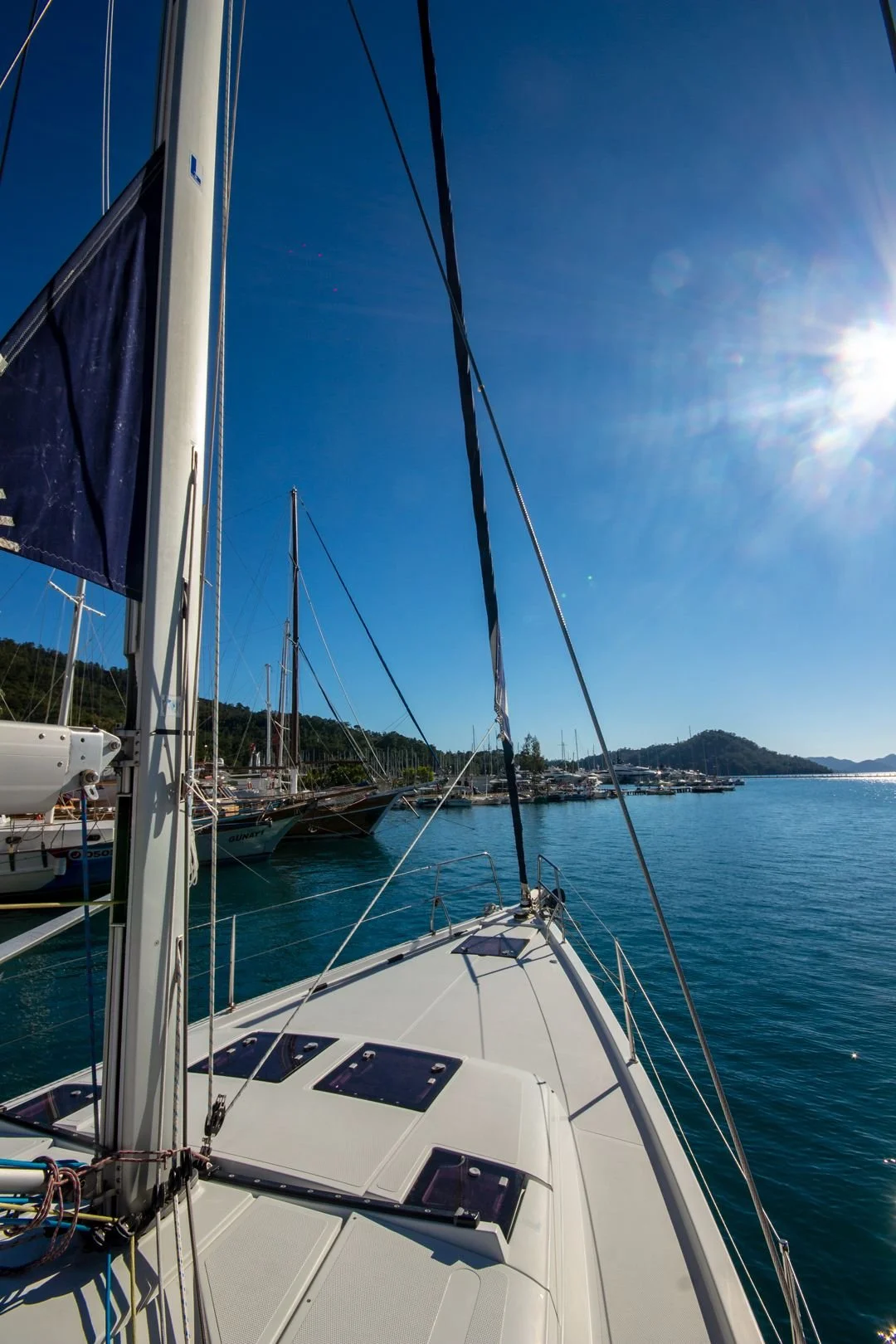 Luxury yacht cruising through Bodrum under sunny Mediterranean skies, showcasing the changing weather and crystal-clear Aegean waters throughout the year.