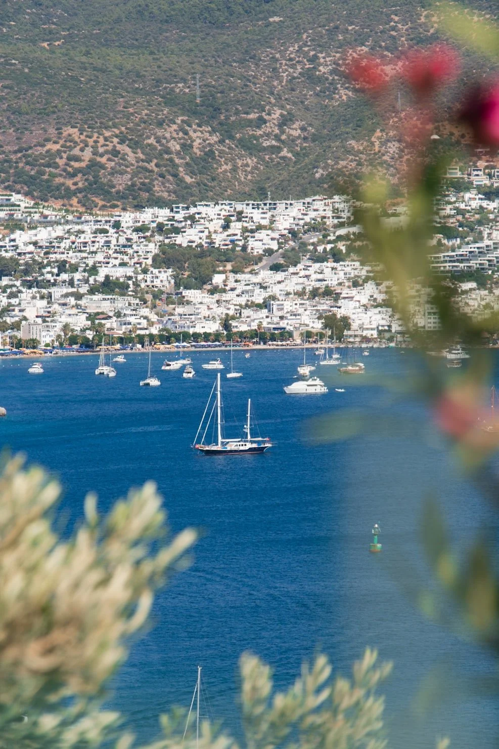 Luxury yacht anchored in one of Bodrum’s hidden coves, surrounded by crystal-clear turquoise waters, secluded beaches and untouched Aegean natural beauty accessible only by boat.