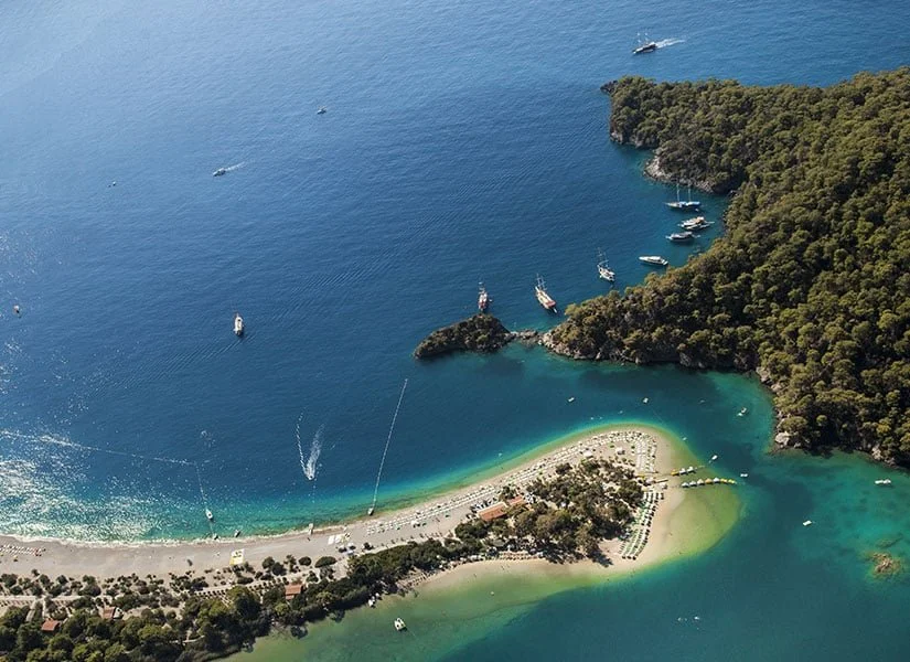 Luxury yacht cruising through the Gulf of Gökova on a seven-day Blue Cruise, stopping at secluded bays, turquoise coves and picturesque coastal villages near Bodrum.