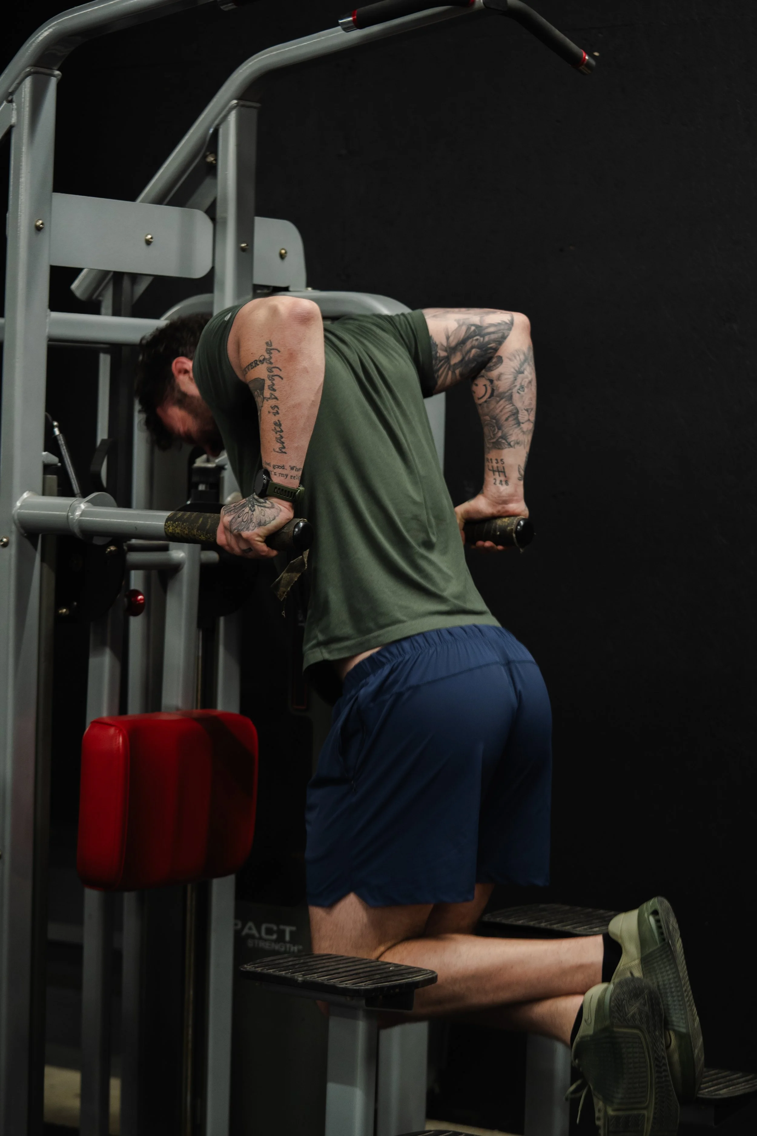 Member performing chest dips during strength training at The Foundry Barbell in Greenville, NC