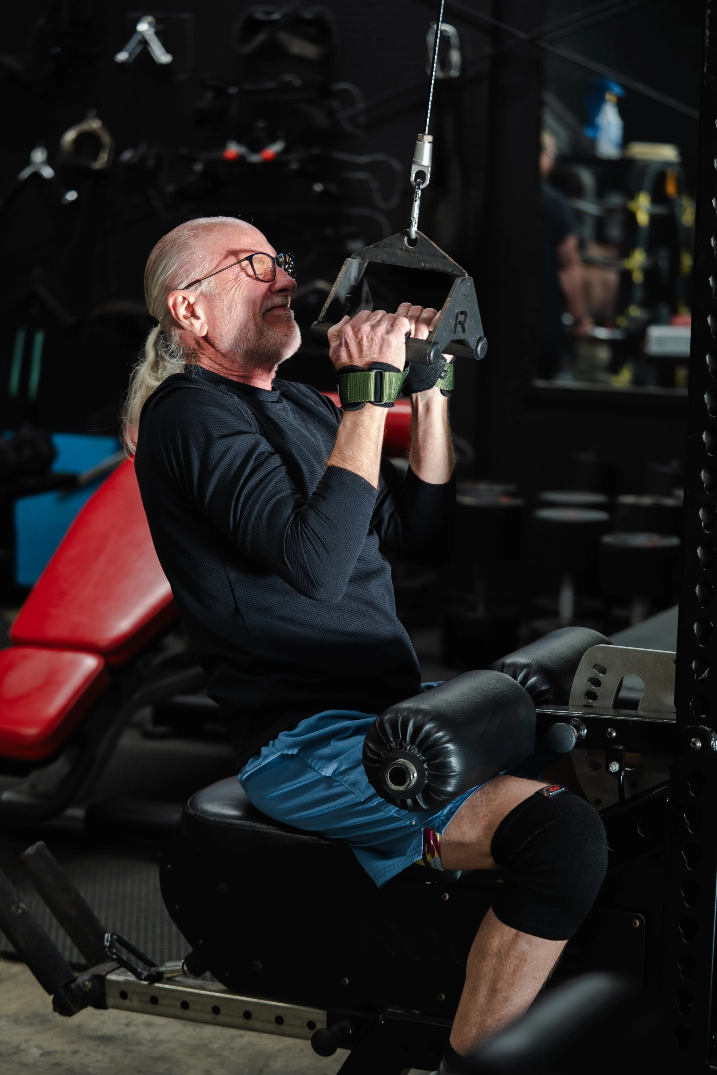 thlete training on a cable row machine during open gym access at The Foundry Barbell in Greenville, NC