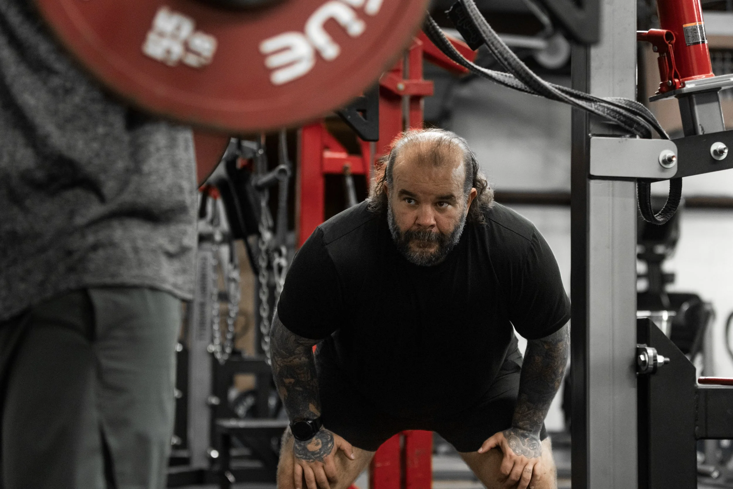 Lifter setting up for a barbell deadlift at The Foundry Barbell, a powerlifting gym in Greenville, NC