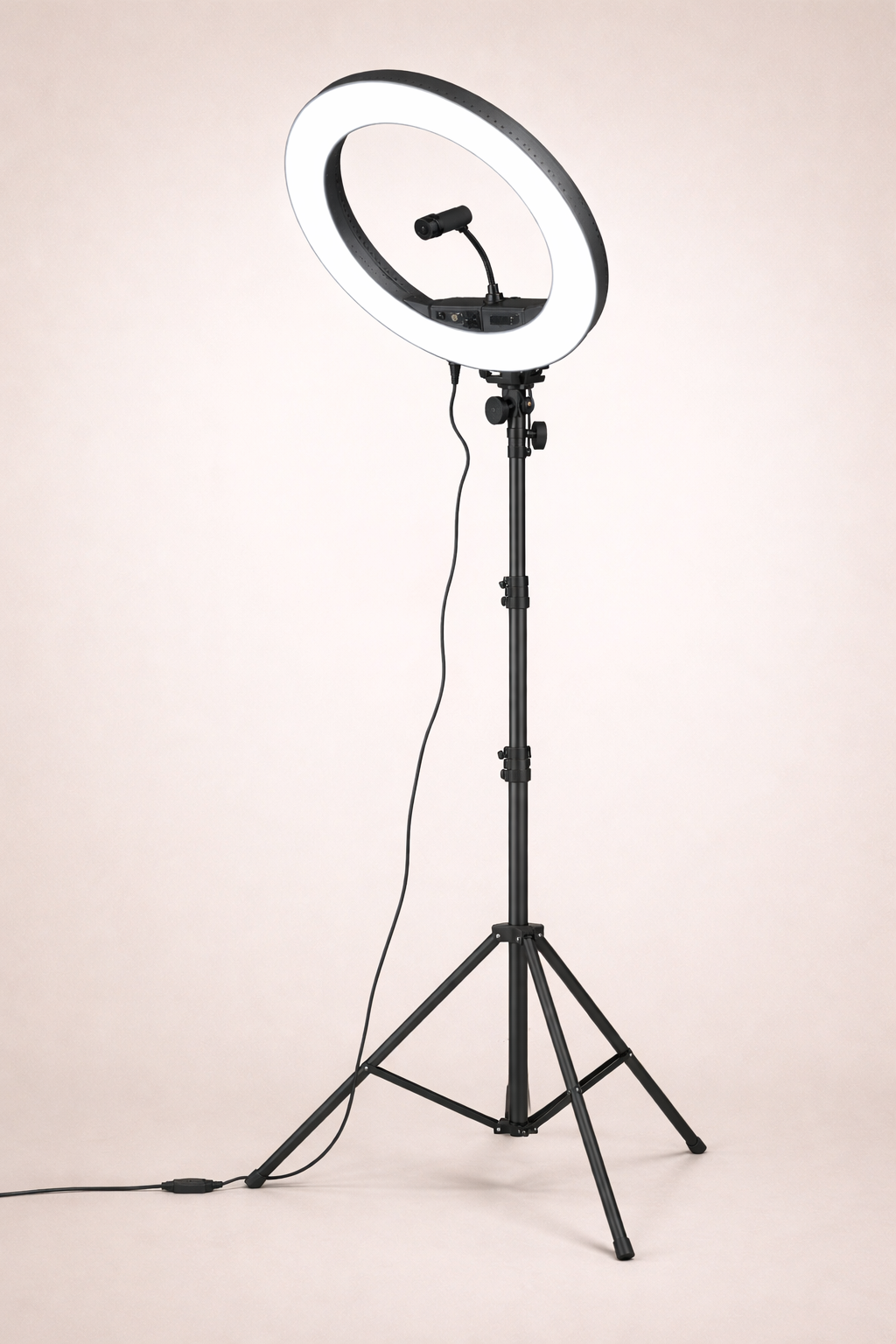 Ring light with adjustable stand on a neutral background.