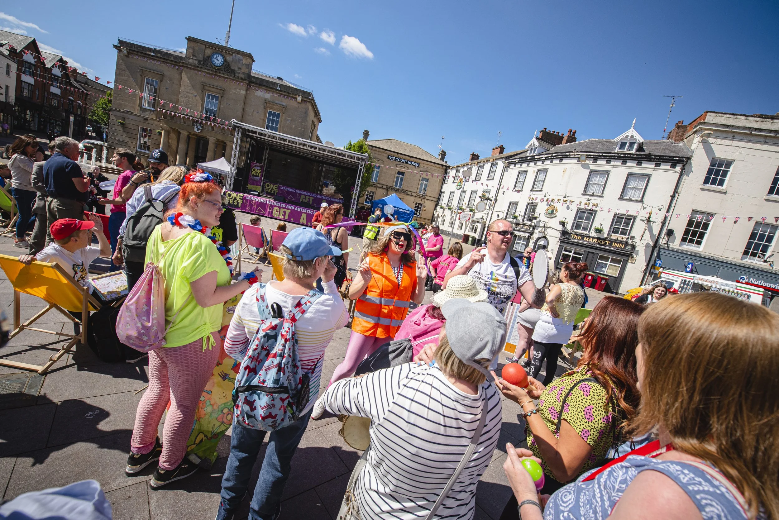 Crowd of people in colourful clothes