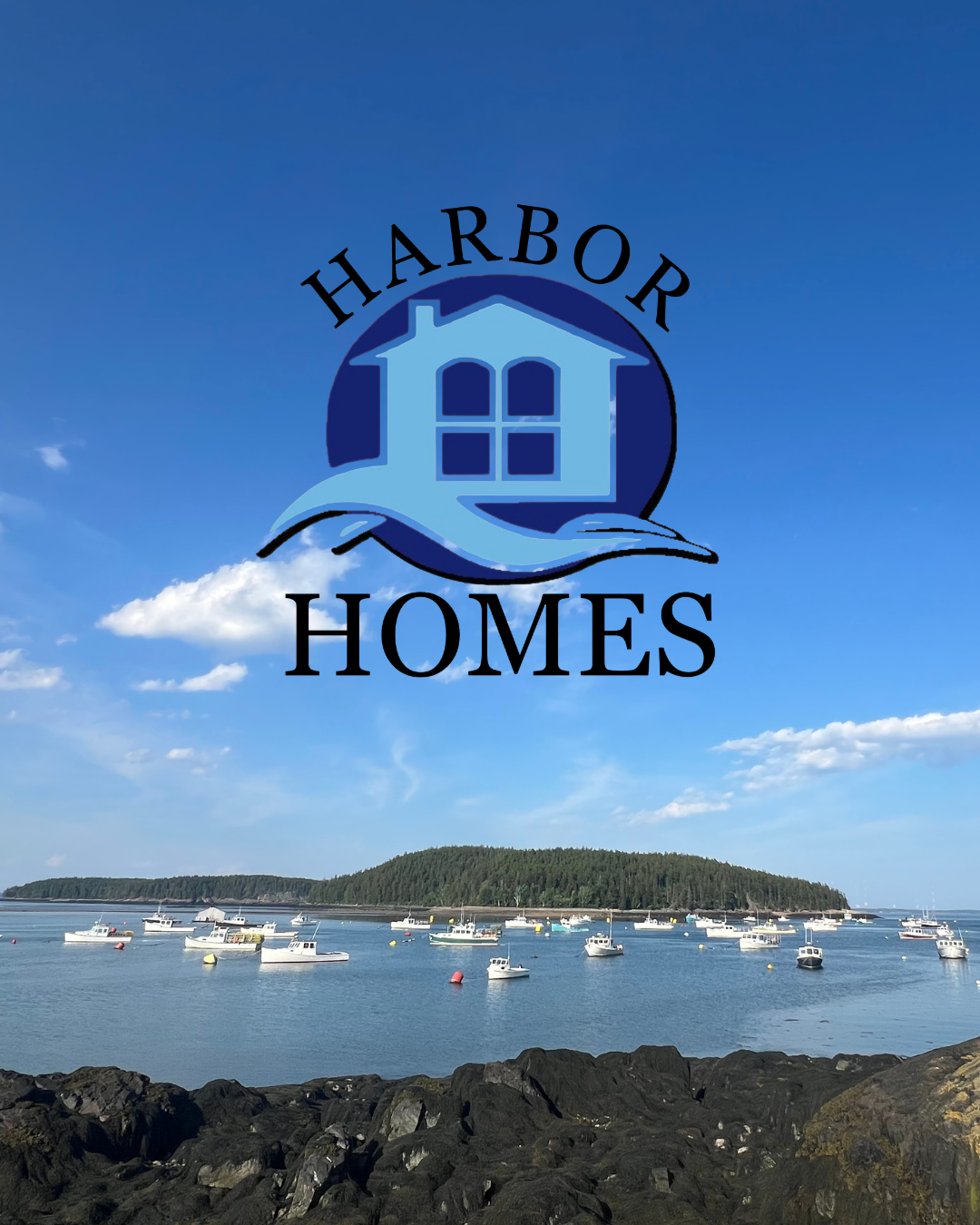 Logo for Harbor Homes featuring a house with a wave underneath and text, overlaid on a scenic coastal view with boats anchored in the water and an island in the background.