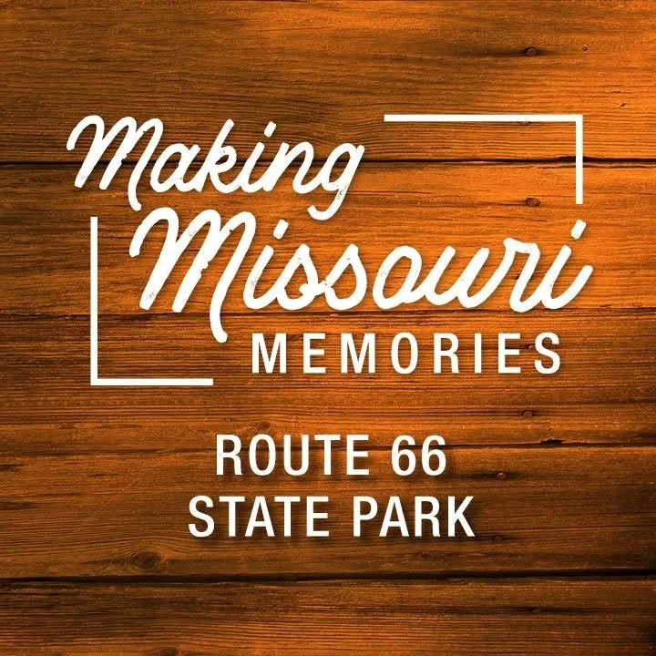 Wooden sign with white text reading "Making Missouri Memories Route 66 State Park."